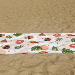 white beach towel psd mockup laying on the sand